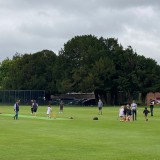 pupils and fathers playing cricket