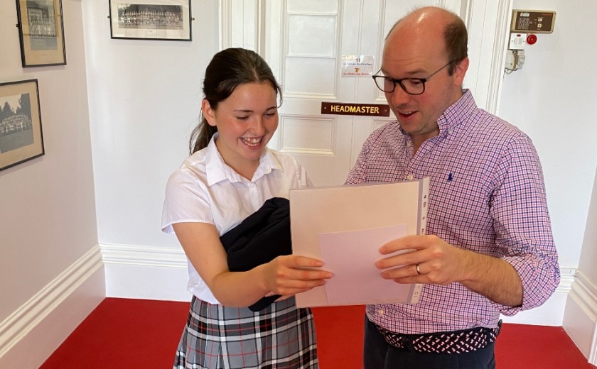 pupil getting her exam results 