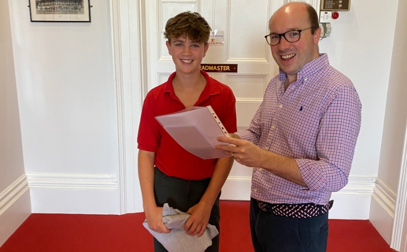 pupil getting his exam results 