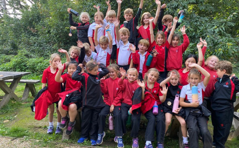 Children exploring woods and building dens